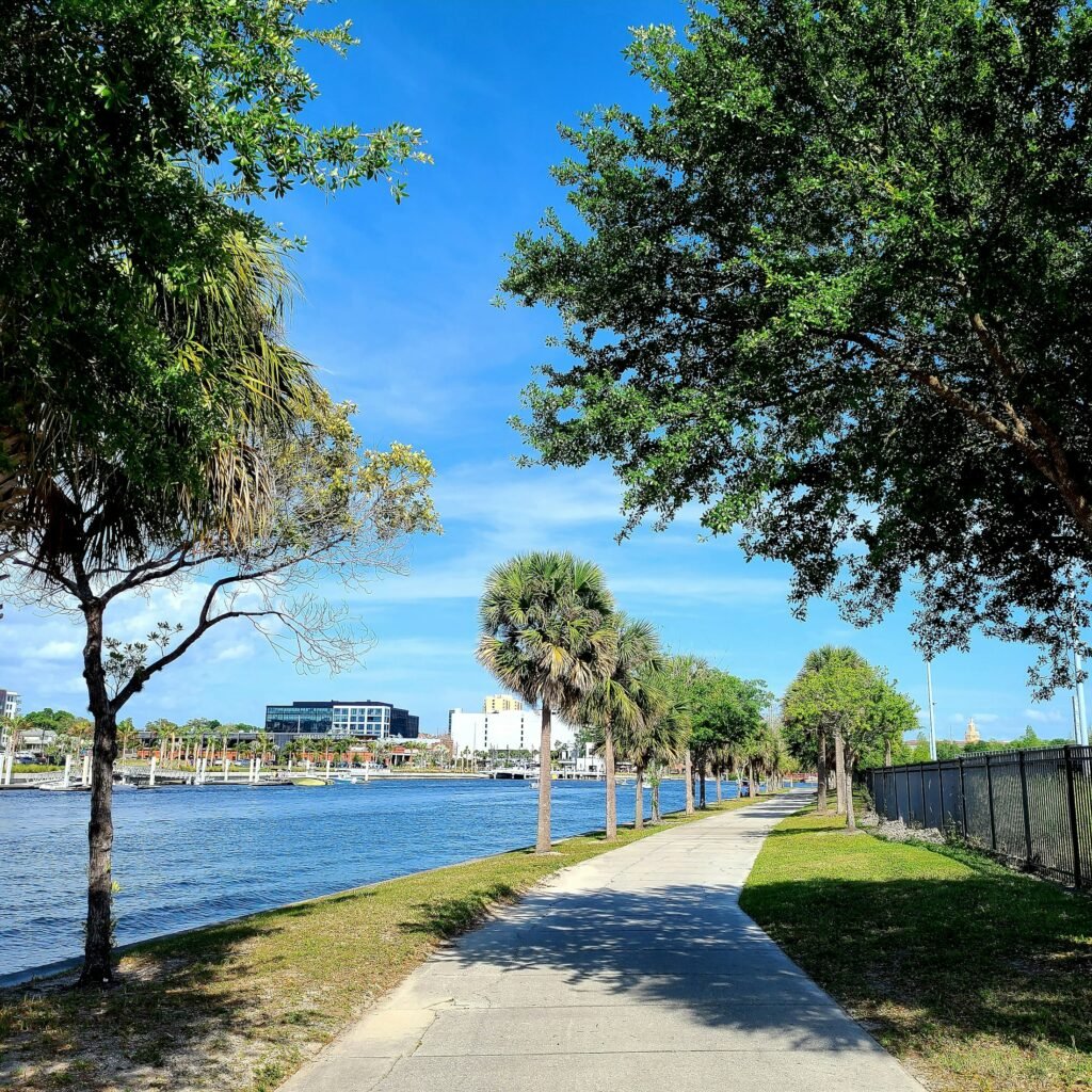Tampa waterfront path with Armature Works across the river